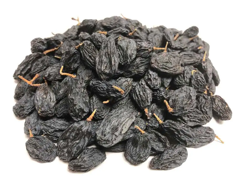 Premium organic black raisins for bulk export, naturally sweet and nutrient-rich from trusted Pakistan black raisins exporter Harmain Global