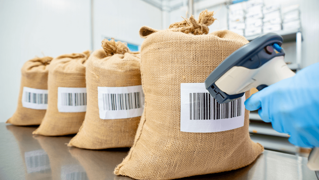 Barcode-labeled Ephedra herb sacks being scanned at a clean facility